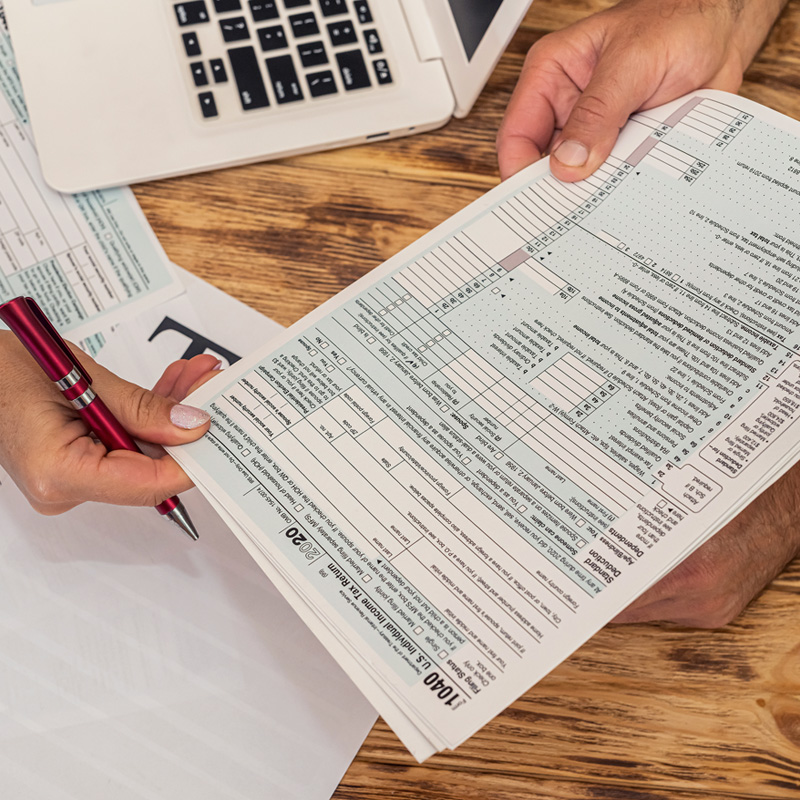 Two people going over tax forms